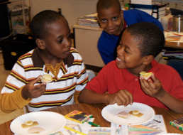 children enjoying snacks